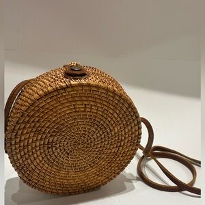 handwoven round rattan crossbody faux leather strap earthy bohemian Bali bag